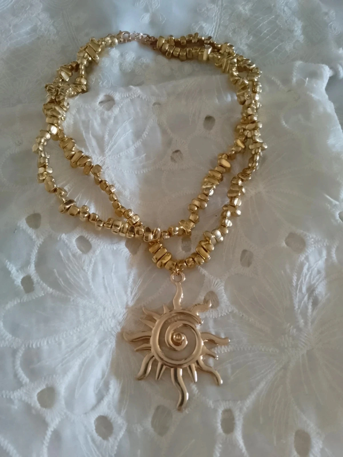Collier double pendentif soleil doré
